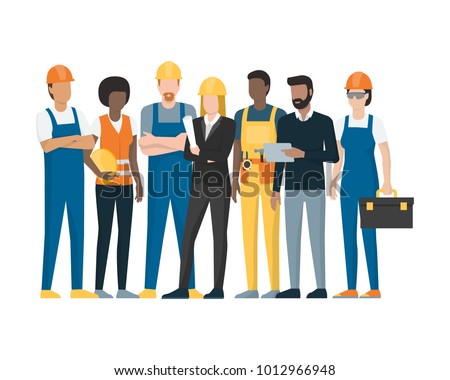 Construction workers and engineers standing together, construction industry concept