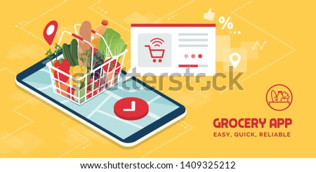 Grocery delivery at home and smartphone app: full shopping basket with fresh vegetables, food and beverage on a mobile phone display