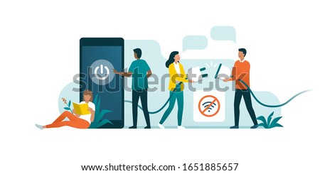 Happy people disconnecting and doing a digital detox, they are unplugging the phone and being offline