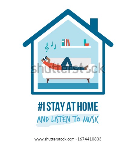 I stay at home awareness social media campaign and coronavirus prevention: man lying on the sofa and listening to music