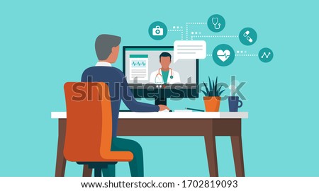 Senior man consulting a doctor online using his computer, telemedicine and online doctor concept