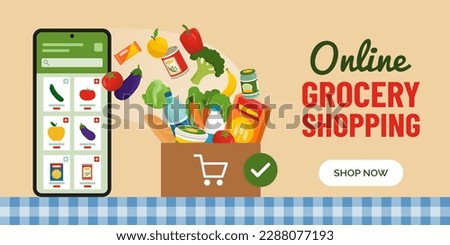 Online grocery shopping app on smartphone and box full of groceries on the kitchen table, banner with copy space
