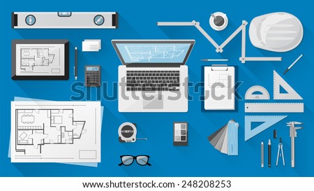 Construction engineer desktop with work tools, tablet and laptop