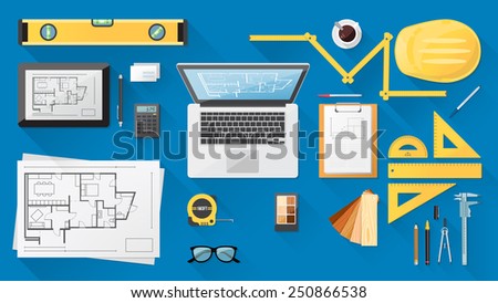 Construction engineer desktop with work tools, tablet and laptop