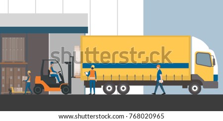 Workers loading the truck with packed goods at the industrial warehouse with a forklift truck: freight transportation, shipment and logistics