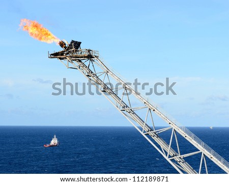 The gas flare is on the offshore oil rig platform in the gulf of thailand.