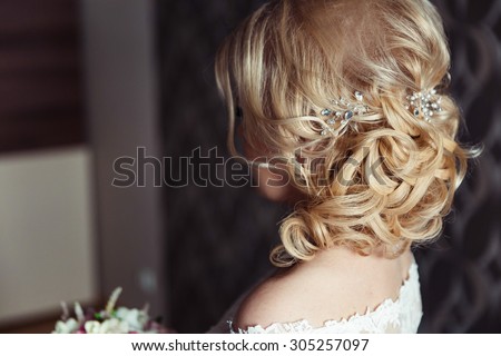Wedding hairstyle of the bride, the beautiful decorations in the head. Wedding accessories. Female jewelry for girls. Details for marriage and for a married couple