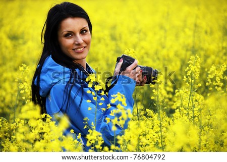 Nature photographer at work in a field of flowers