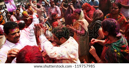 DELHI, INDIA - MARCH 08: People covered in paint on Holi festival, March 08, 2012, Delhi, India. Holi, the festival of colors, marks the arrival of spring, being one of the biggest festivals in India