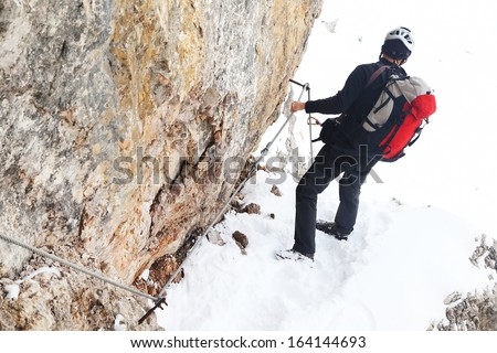 Alpinist climbing ferrata La torre di Toblin (2.617 m), Dolomites, Italy, Europe