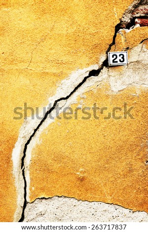 Crack in the house in ruins - wall of house destroyed during earthquake