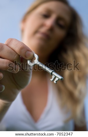 woman holding a key