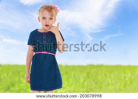 charming little girl gesturing.walk in the field, summer joy,happiness concept,happy childhood,carefree childhood,active lifestyle