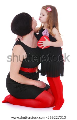Stylish Mom and daughter kissing. - isolated on white background