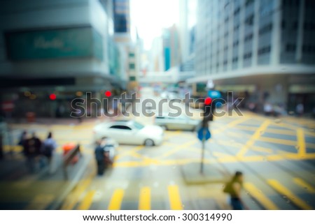 Blurred crowded city background with vintage color tone tuned