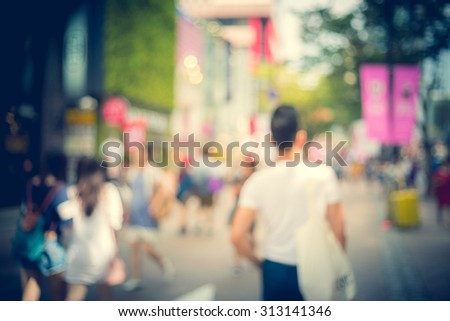 Blurred shopping in Seoul city street background with vintage tone tuned