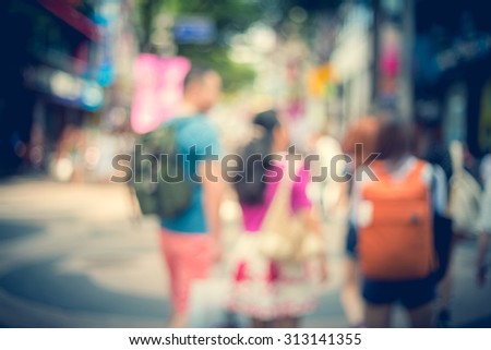 Blurred shopping in Seoul city street background with vintage tone tuned