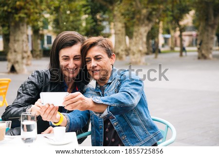 Similar – Image, Stock Photo Happy middle aged lesbian couple hugging outdoors