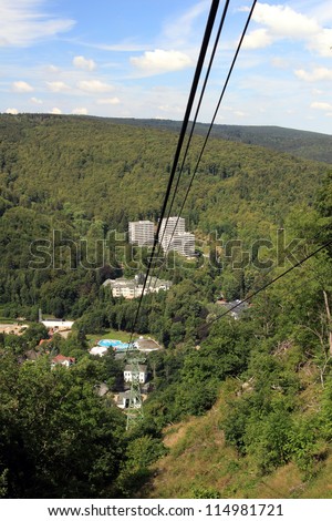BAD HARZBURG, GERMANY - JULY 28: view along the cables of mount burgberg cable car to the bad harzburg valley station  , Burgberg June 28, 2011 in Bad Harzburg, Germany