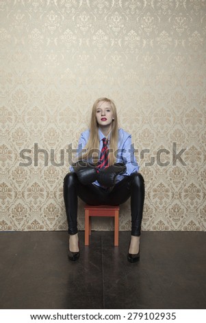 young business woman sitting on a stool