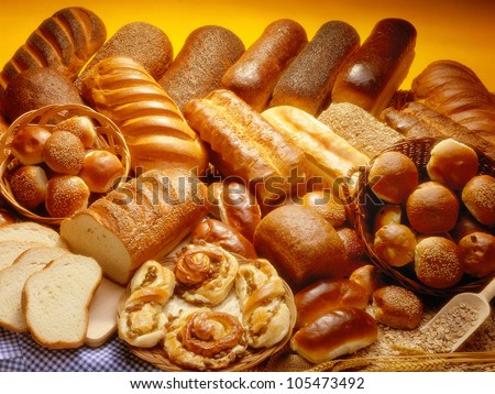 Bakery product assortment with bread loaves, buns, rolls and Danish pastries