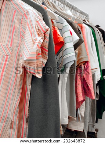 Rack of summer clothes in thrift shop.