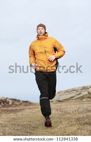 A man jogging by the sea, Sweden.