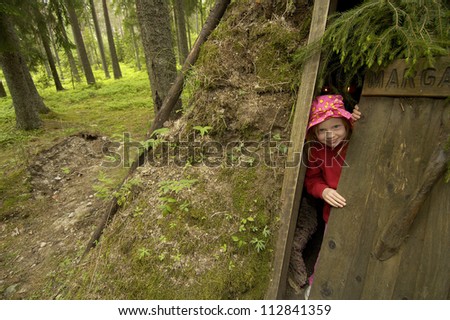 Child in Old charcoal workers hut, now hotel