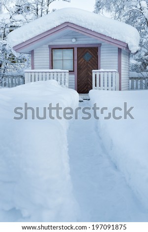Path through snow going to small house, Kiruna, Lapland, Sweden