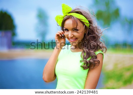 Cheerful and happy woman. Emotions. Face. Close-up. Portrait of beautiful smiling girl outdoors. Emotional girl in bright clothes
