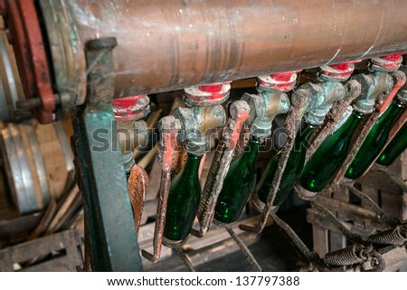 Old machine for filling the bottles with beer, brussels, Belgium