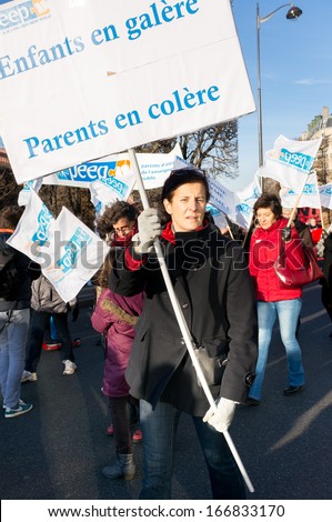 PARIS - DECEMBER 5: French parents demonstrate against the change of the rhythm of elementary school  on December 5, 2013 in Paris, France. This controversial change began this September.