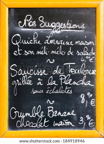 French restaurant menu written with chalks on blackboard