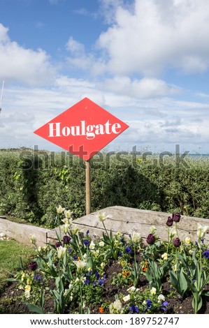 Red sign of the Houlgate village by the road, Normandy, France