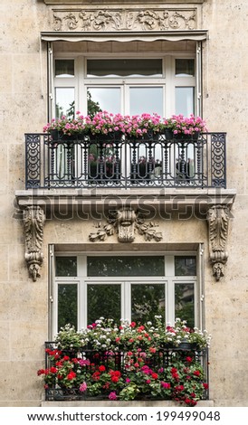 Typical Parisian windows with  flowers, Paris, France