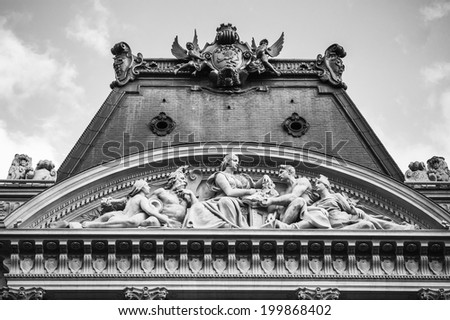 Classic statues on the the roof of a Parisian building, Paris, France