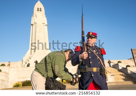 DOUAUMONT, FRANCE - NOVEMBER 11, 2013: Man in uniform of French army in World War I in the Armistice Day at Douaumont Ossuary near Verdun, France. 2014 is the centennial of the first world war.