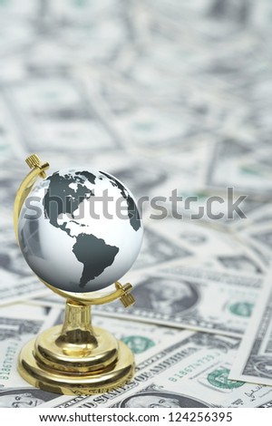 Globe on US paper currency, close up