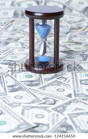 Hourglass on US paper currency, close up