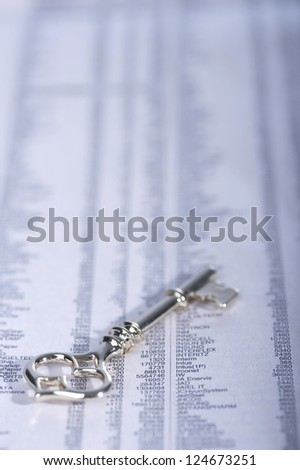 Financial paper with a key, close up