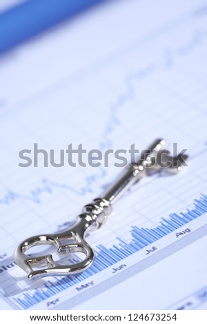Financial paper with a key, close up