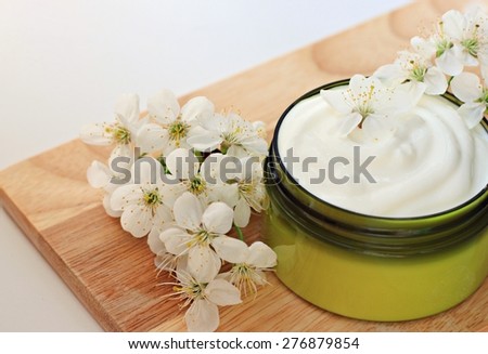 jar of herbal moisturizing skin cream flowers organic