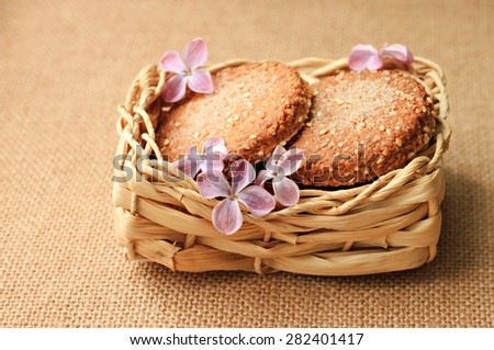 homemade bakery cookies straw rustic container summer flowers burlap tablecloth