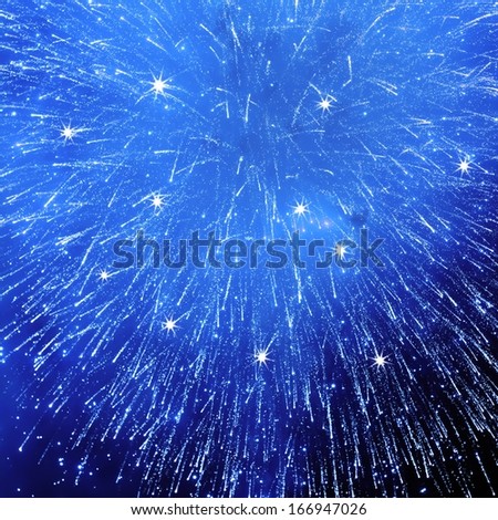 blue fireworks with stars against night background for new year celebration