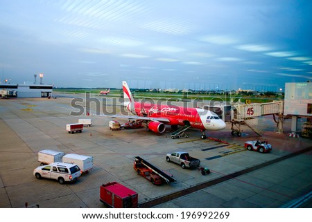 BANGKOK/THAILAND-MAY  16 : Air Asia aircraft docking at  Don Mueang International Airport on May 16, 2014. Don Muang is  the main hub for low cost airlines.