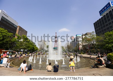 SAPPORO, JAPAN - MAY 6, 2015: Recreation of Japaneses and tourists during Japan Golden week at Sapporo TV Tower located on the ground of Odori Park.