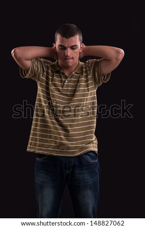 thinker and sad teenager with both hands behind his neck, emotion portrait