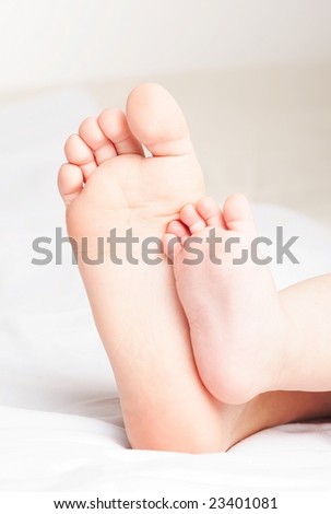 Brother\'s and sister\'s feet