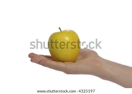 The Hand of the Person gives the yellow apple, on white background.