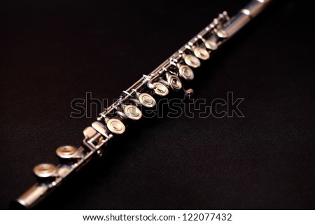 Flute on black background